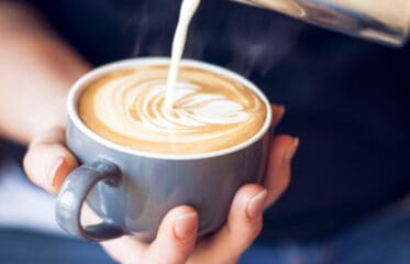 Barista pouring a coffee